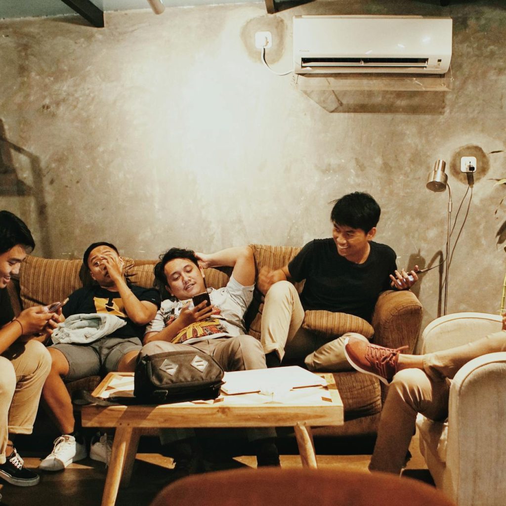 men sits of sofa